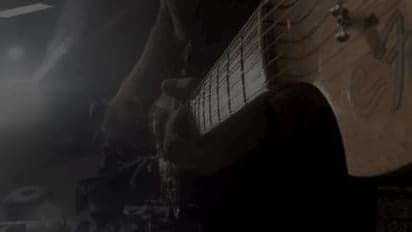 A still from the “Writing on the Wall” music video by Olds Cool.